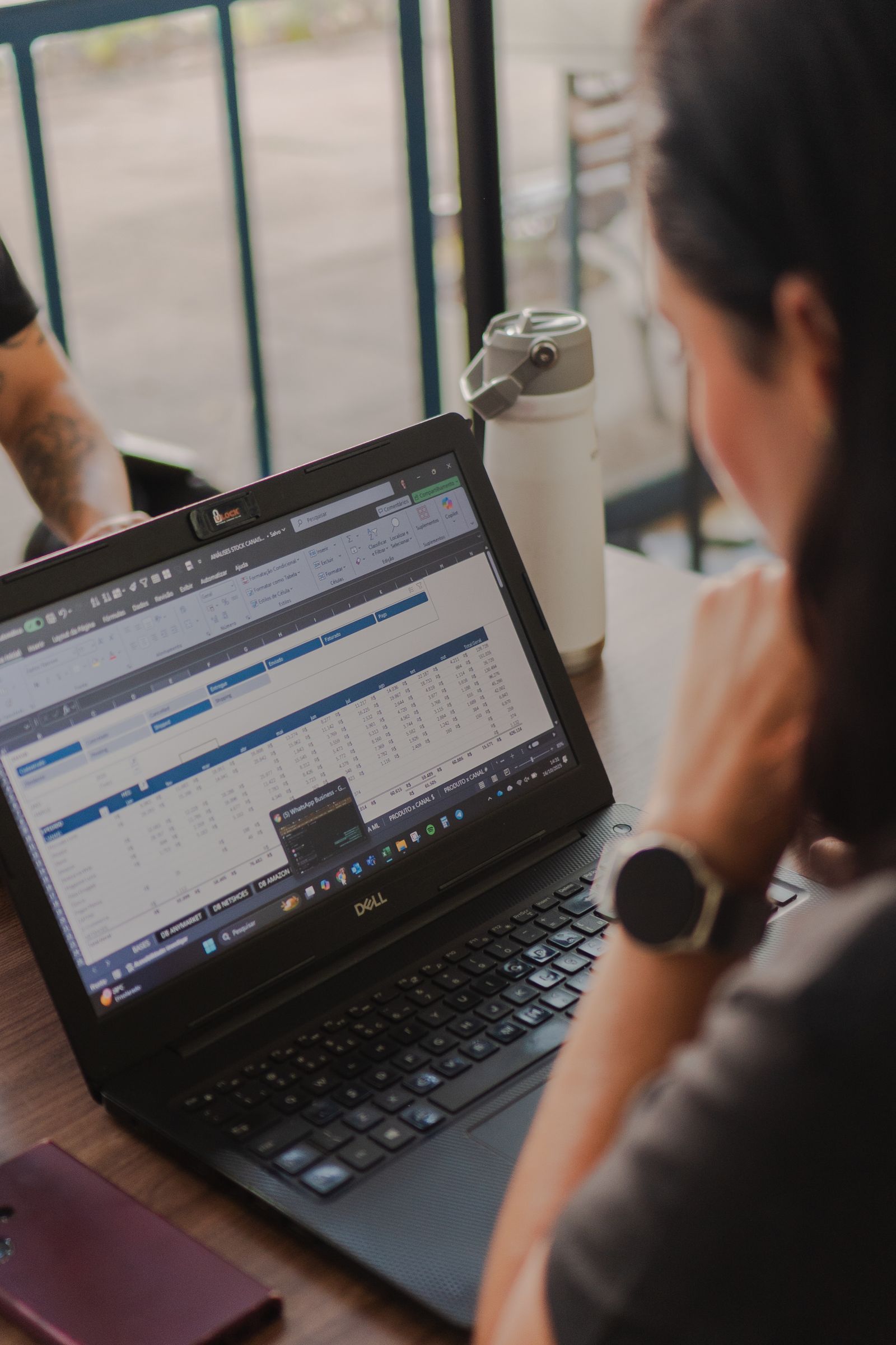 Finance professional reviewing a detailed Microsoft Excel spreadsheet